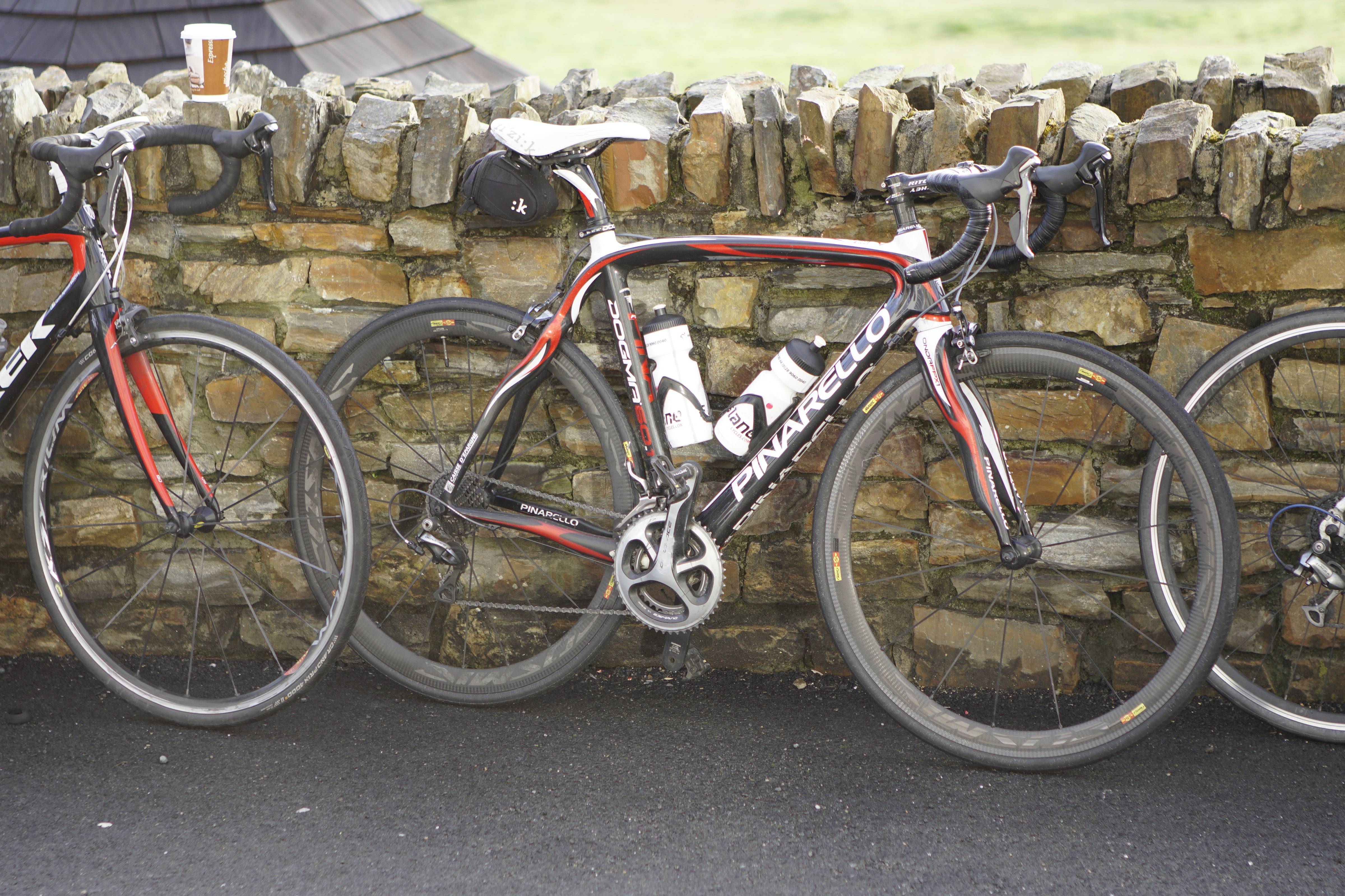 Bicycles leaning against stone wall 